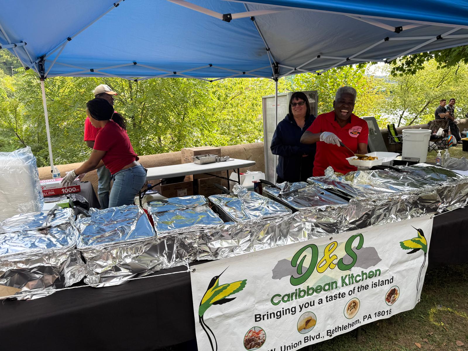 Caribbean food vendor booth at the festival