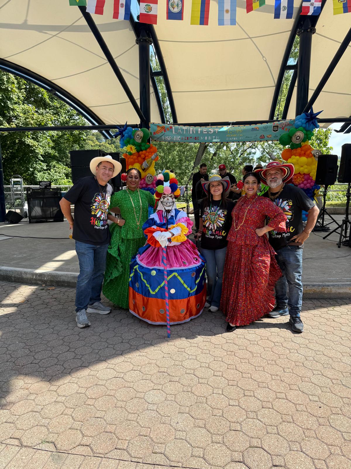 Cultural performers and festival organizers together on stage