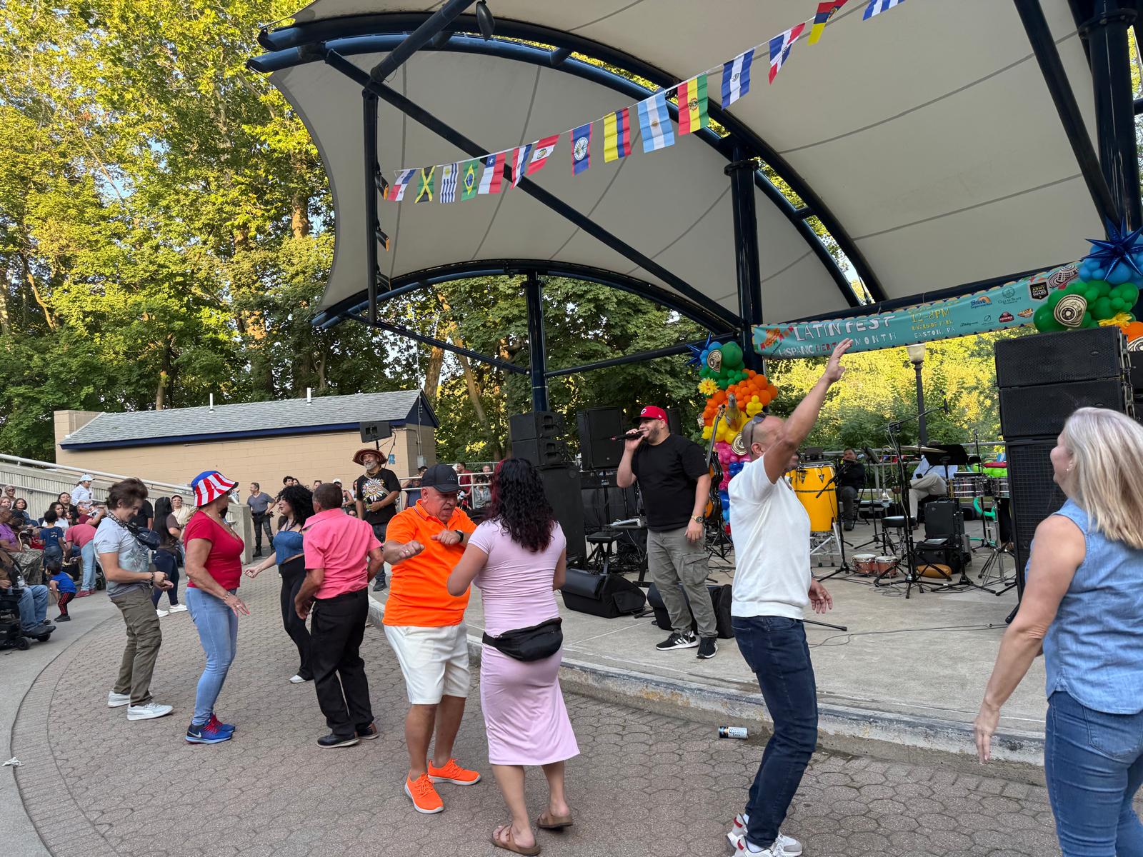 Festival visitors dancing together in front of the stage
